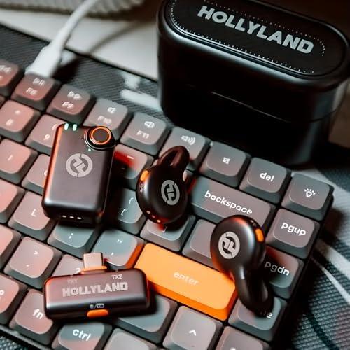 Fones de ouvido e acessórios em teclado de computador.